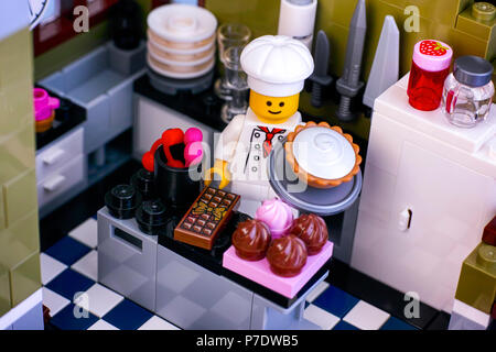 Tambov, Russian Federation - January 04, 2018 Lego chef preparing desserts in the kitchen. Studio shot. Stock Photo
