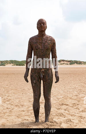Another Place a modern art installation on crosby beach, liverpool, uk.by sculptor Antony Gormley Stock Photo