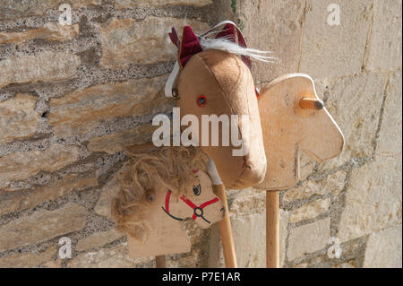 A selection of toy wooden horses ready for play. Stock Photo