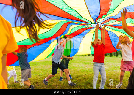 Boy under a parachute Stock Photo: 78113296 - Alamy