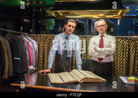 Two tailors in traditional tailors shop, portrait Stock Photo