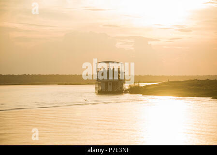 Boat on river at sunset, Chobe National Park, Botswana Stock Photo