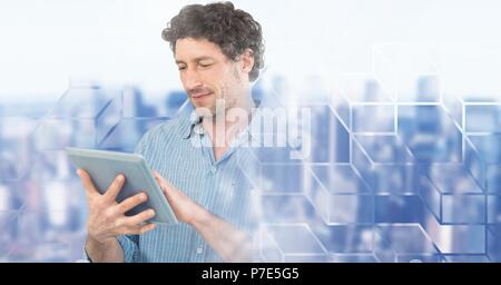 Man using laptop with geometric city transition Stock Photo