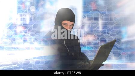 Hacker balaclava man on laptop with geometric city transition Stock Photo