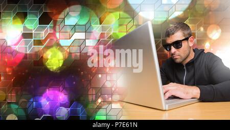 Man using computer with geometric transition Stock Photo
