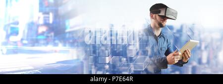 Man using tablet wearing virtual reality headset with city transitions Stock Photo