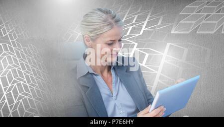 Woman using laptop with geometric transition Stock Photo