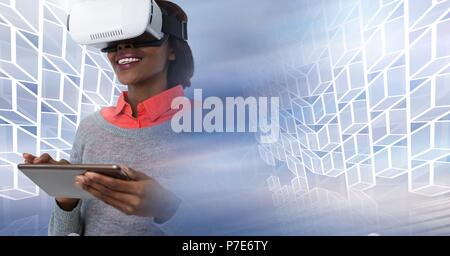 Woman wearing virtual reality headset using tablet with geometric transition Stock Photo