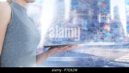 Woman using tablet with geometric city transition Stock Photo