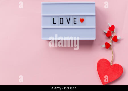 Happy valentines day, i love you concept, lettering on light box, rose petals, white background. Heart shape, store front sign, sale, discounts, clear Stock Photo