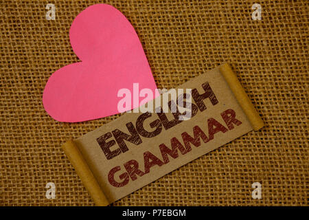 Handwriting text English Grammar. Concept meaning Language Knowledge School Education Literature Reading Ideas on old vintage paper black red letters  Stock Photo