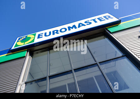 Euromaster sign at garage. Euromaster offers tire services and vehicle maintenance across Europe and is a subsidiary of the tire maker Michelin. Stock Photo