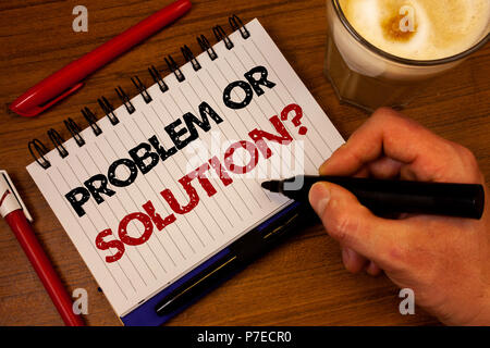 Word writing text Problem Or Solution Question. Business concept for Think Solve Analysis Solving Conclusion Hand grasp black marker wooden desk red p Stock Photo