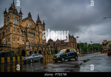 MUMBAI, INDIA - JUNE 24, 2018 : A famous black & yellow collored taxi running on the streets of Mumbai opposite CST station Stock Photo