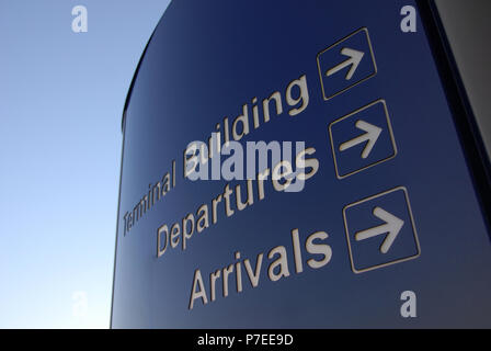 Blue advice signs outside the main doors at Doncaster Sheffield Airport, formerly named Robin Hood Airport Doncaster Sheffield, Stock Photo