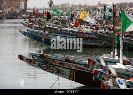 Colorful painted pirogues in the fisherman's wharf of Saint-Louis-du-Sénégal, Senegal Stock Photo