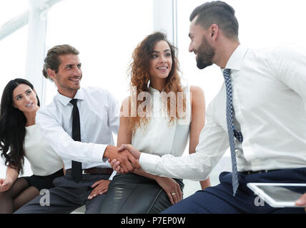 welcome handshake between two colleagues. Stock Photo