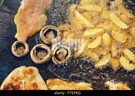 Close up of barbecue grill with various kinds of juicy meat with potato for party Stock Photo