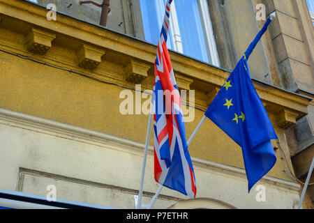 EU and UK flags coalition together. European Union and United Kingdom flags next to each other. Stock Photo