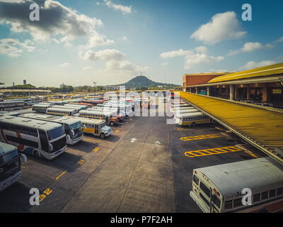 Panama City - march 2018: Many colorful old buses on bus and train station Albrook in Panama City Stock Photo