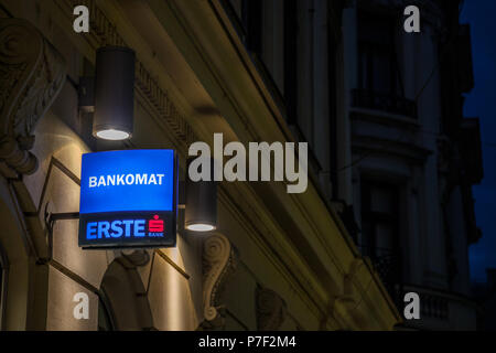 BELGRADE, SERBIA - JUNE 28, 2018: Logo of Erste Bank at night on its main office in Belgrade, indicating the presence of an ATM, or Bankomat. Erste is Stock Photo