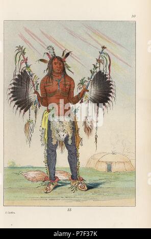 Mandan medicine man Mah-to-he-hah, Old Bear, painted with various colours, bear grease and charcoal, holding feathered medicine pipes and wearing fox tails on his heels. Handcoloured lithograph from George Catlin's Manners, Customs and Condition of the North American Indians, London, 1841. Stock Photo