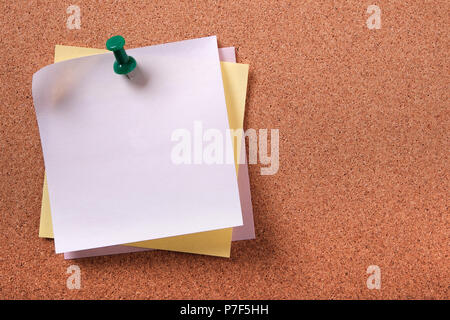 Various colors several sticky post notes pinned pushpin cork background Stock Photo
