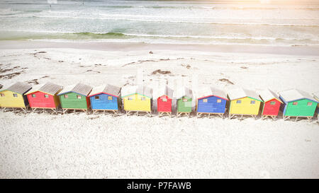 Colorful wooden houses on sand Stock Photo