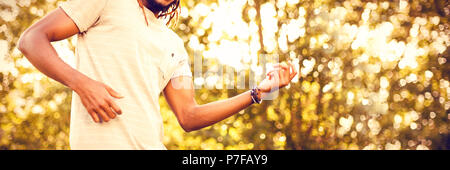 Cheerful man standing in park Stock Photo