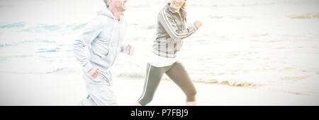 Fit couple jogging together Stock Photo