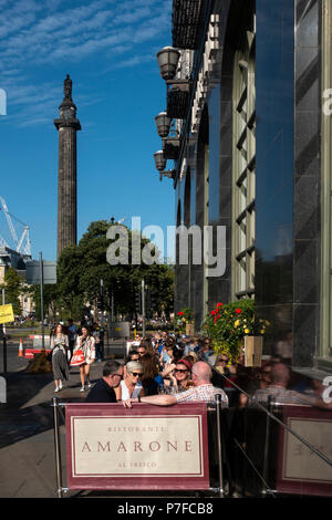 People sitting outside in afternoon sunshine in Amazon restaurant on George Street, Edinburgh, Scotland, UK Stock Photo