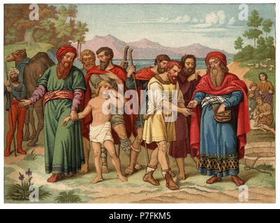 Historia Sagrada. José, hijo preferido del patriarca Jacob y de Raquel, es vendido como esclavo por sus hermanos. Grabado de 1916. Stock Photo