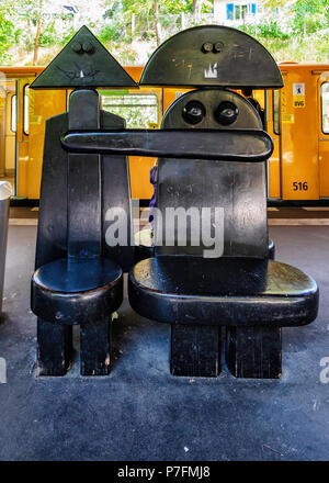 Berlin Dahlem-Dorf U-Bahn railway station on the U 3 line, platform with  unusual seating, Male & Female Bench design by Berlin artist Wolf van Roy. S Stock Photo