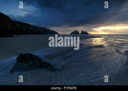 Sunset behind dark clouds, Holywell Beach, Holywell Bay, near Newquay, Cornwall, Great Britain Stock Photo