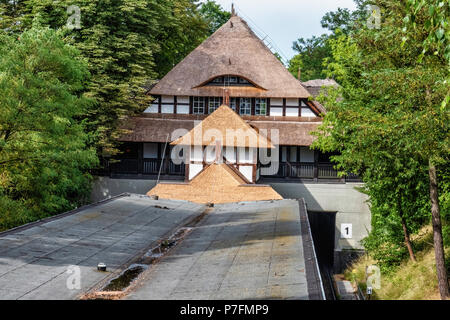 Berlin Dahlem-Dorf U-Bahn underground railway station on the U 3 line. Historic building exterior with thatched roof and tudor-style facade. Stock Photo