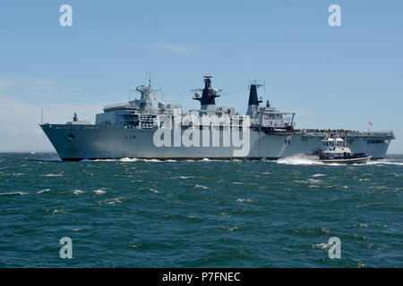 180629-N-XN177-0052 YOKOSUKA, Japan – The British Royal Navy Amphibious Assault Ship HMS Albion (L 14) arrives at U.S. Fleet Activities (FLEACT) Yokosuka for a scheduled port visit.  FLEACT Yokosuka provides, maintains, and operates base facilities and services in support of 7th Fleet’s forward-deployed naval forces, 71 tenant commands, and 27,000 military and civilian personnel.  (U.S. Navy photo by Mass Communication Specialist 1st Class Peter Burghart/Released) Stock Photo