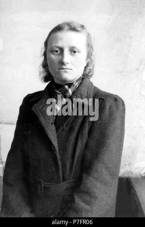 Poor woman in a coat, post-war period, 1948, Leipzig, Germany Stock Photo