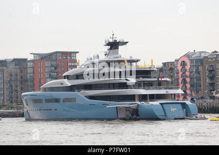London, UK. 5th July, 2018. In an extraordinary show of billionaire wealth Tottenham Football Club owners Joe Lewis's Super yacht Aviv (light blue) has been joined on the Thames by Tower Bridge by the brand new $100m Elandess (dark blue) reportedly owned by Travelex founder and Philanthropist Sir Lloyd Dorfman.  Both super yachts have been  built by German shipyard of Abeking and Rasmussen in Lemwerder. The yachts boast a wealth of luxurious features including swimming pools, tennis courts, gyms and impressive art collections. Credit: Nigel Bowles/Alamy Live News Stock Photo
