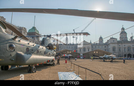 Horse Guards Parade, London, UK. 6 July, 2018. RAF100, an exhibition of aircraft covering the RAF’s history, from WW1 and WW2 through to the modern age are displayed at Horse Guards Parade in central London, open to the public from 11.00am on 6th till 9th July 2018 with RAF uniformed re-enactors bringing the displays to life. Chinook twin rotor helicopter and Meteor FR4, Britain’s first jet fighter, and the actual aircraft that set the world air speed record in 1946. Credit: Malcolm Park/Alamy Live News. Stock Photo