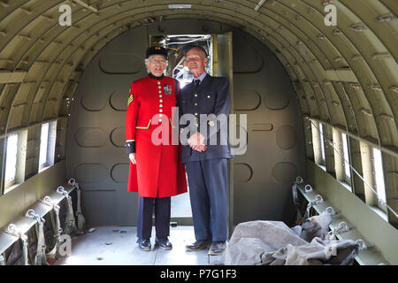 London,UK,6th July 2018,Chelsea Pensioner inside a Dakota at The RAF100 Aircraft Tour in Horse Guards Parade. Eight RAF aircraft, old and new, including a full-size replica of Britain's state of the art stealth combat aircraft, a Typhoon, a Spitfire, a Chinook and a BE2c - the classic First World War bomber biplane are on display until Sunday 8th July. There is also an educational zone focussed on aviation and aerospace activities, designed to encourage interest and participation from young people. Credit: Keith Larby/Alamy Live News Stock Photo