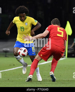 Kazan, Russia. 6th July, 2018. Willian (L) of Brazil vies with Jan Vertonghen of Belgium during the 2018 FIFA World Cup quarter-final match between Brazil and Belgium in Kazan, Russia, July 6, 2018. Credit: He Canling/Xinhua/Alamy Live News Stock Photo