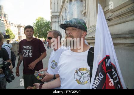 London, UK. 6th July 2018. , cannabis for medical use supporters , rallied  to support a second reading of MP Paul Flynn bill to legalize the medicinal use of cannabis . the bill was postponed , so in defiance members took the protest a little further to downing street . one man was arrested for assault during a altercation with members over the sale of fake cannabis oil. Credit: Philip Robins/Alamy Live News Stock Photo