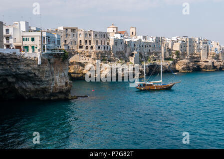 Polignano a Mare, Italy - August 11, 2017 breathtaking sight, Puglia, Italy. Italian panorama. Cliffs on adriatic sea and boat. Stock Photo