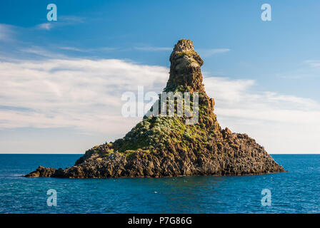 One of the sea stacks in Acitrezza (Catania, Sicily), called Faraglione Grande Stock Photo