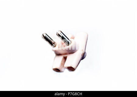 Close up of a three pin plug isolated on a white surface. Stock Photo