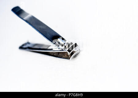Close up of an stainless steel's Nail cutter isolated on a white surface. Stock Photo