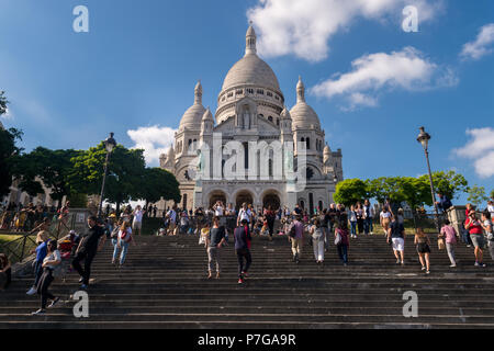 Paris, France - 25 June 2018: Tourists walking in front of Basilica Sacre Coeur in Montmartre Stock Photo