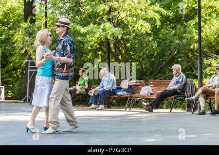 Elderly people dancing in the Sokolniki Park in Moscow, Russia. Many parks in Moscow have a place where pensioners and others can meet and dance. Stock Photo