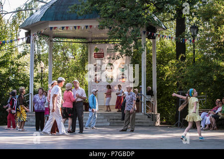 Elderly people dancing in the Sokolniki Park in Moscow, Russia. Many parks in Moscow have a place where pensioners and others can meet and dance. Stock Photo