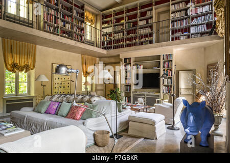 Modernised double height mezzanine library in 18th century chateaux, St Remy de Provence Stock Photo